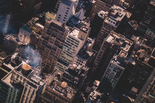 New York City, USA. Midtown Manhattan building rooftops with steam comming from the heating systems.