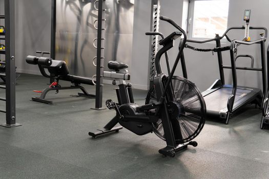 Air bike gym cardio air, for female endurance for sport for club motivation, person power. Air cycle physical, activity