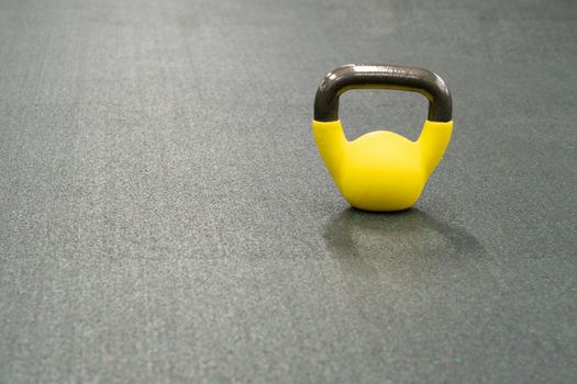 Yellow kettlebell weight background exercise, for fitness sport in bodybuilding for metal steel, shape raining. Pace active tudio, competition dumbbell black fresh black background object