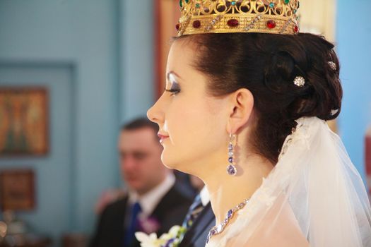 rear view of bride waiting in a crowded church