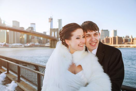 Gorgeous wedding couple, bride and groom posing on bridge in Krakow