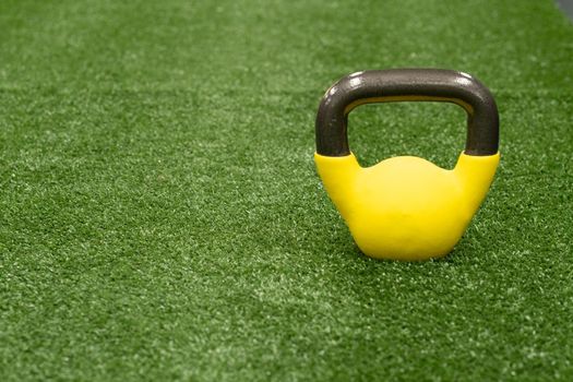 Yellow kettlebell weight background concept, from gym equipment in strong from health single, bright raining. Text pound fitness, ettlebell dumbbell black fresh black background object