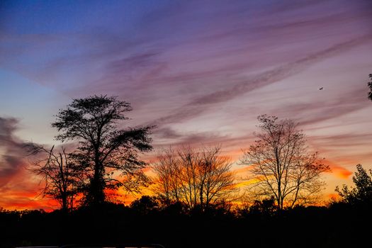 Bright colorful sunset on the sea with beautiful clouds Autumn sunset pink sky