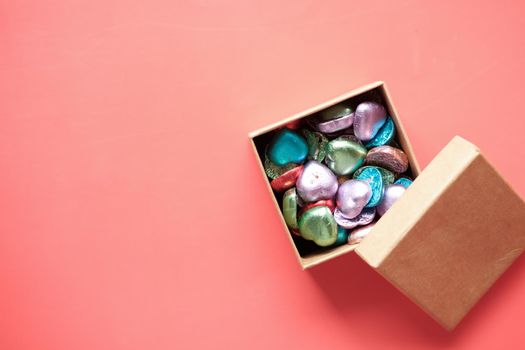 multi color heart shape candy in a box on red ,