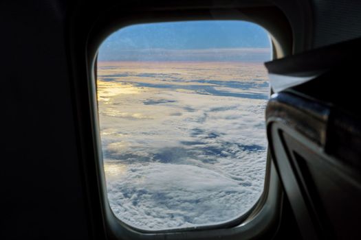 aerial view of blue sky with clouds from window of jet flight