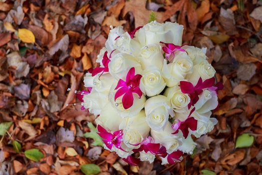 Bridal bouquet of roses on a wooden planks bridal bouquet of white roses on a background of leaves