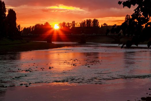 sunset on the background of the river river bank sunset Uzgorod Ukraine
