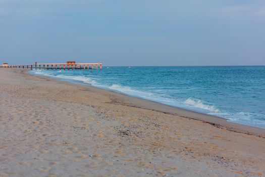 yellow warm sand and summer sea with sky and free space