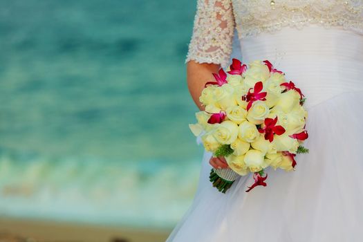 a bride is holding a bouquet bridal bouquet of roses