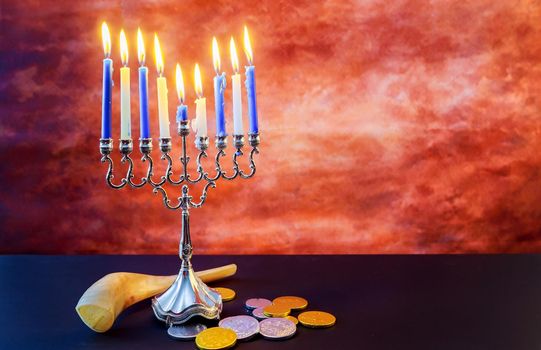 Jewish holiday hanukkah celebration with vintage menorah tallit