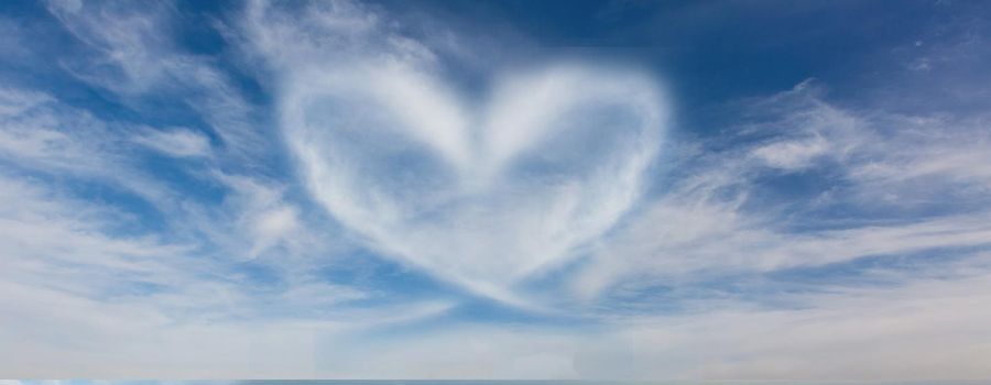 A cloud in the form of a heart. A figure from the clouds in the sky. Beautiful sky. Love. Imagination. Valentine's Day. Lovers. Fluffy cumulus cloud looks like a heart. Valentine's day symbol.