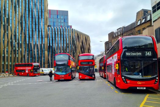 London, United Kingdom, February 9, 2022: bus station with red double-decker buses