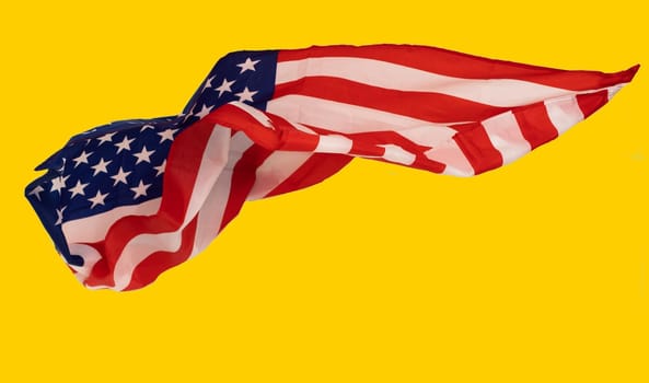 closeup of american flag on yellow background. High quality photo