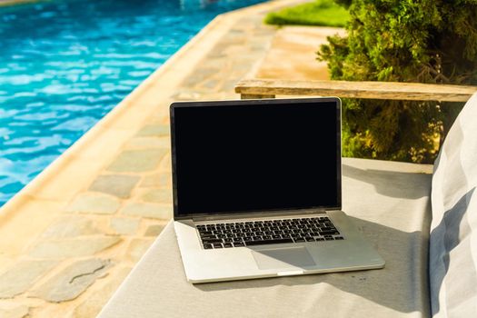 computer on table background as a pool.