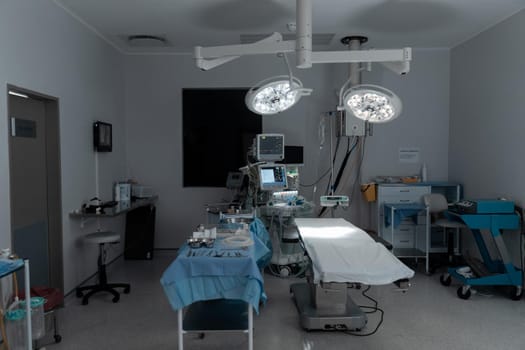 Surgical instruments, operating table, lights and equipment in modern hospital operating theatre. medicine, health and healthcare services.