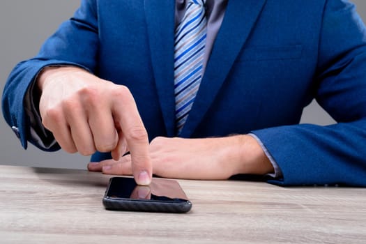 Midsection of caucasian businessman using smartphone, isolated on grey background. business technology, communication and growth concept digitally generated composite image.