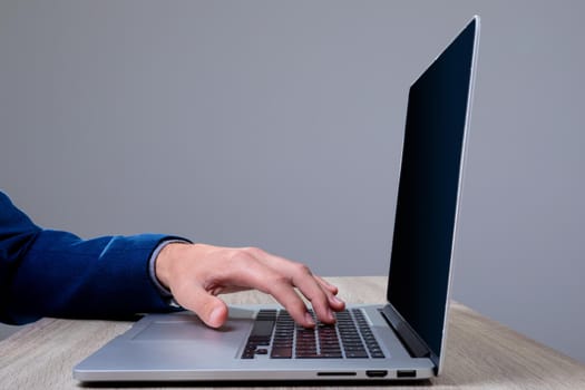 Midsection of caucasian businessman typing on keyboard, isolated on grey background. business technology, communication and growth concept digitally generated composite image.