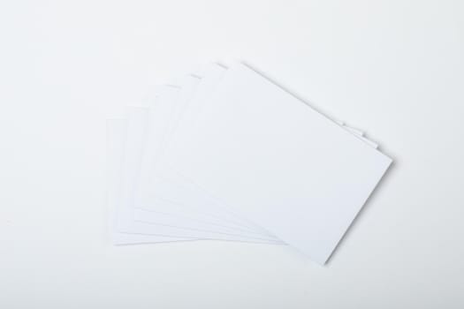 Composition of blank white cards with copy space on white background. christmas, tradition and celebration concept.