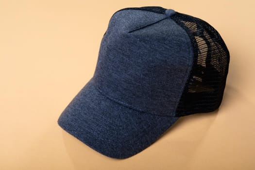 Composition of close up of grey and black baseball cap with mesh back on yellow background. fashion and accessories concept.