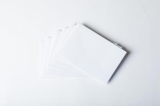 Composition of blank white cards with copy space on white background. christmas, tradition and celebration concept.