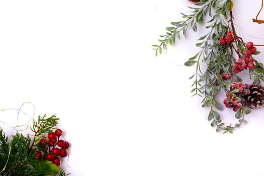 Composition of tree branches with pine cones and copy space on white background. christmas, tradition and celebration concept.