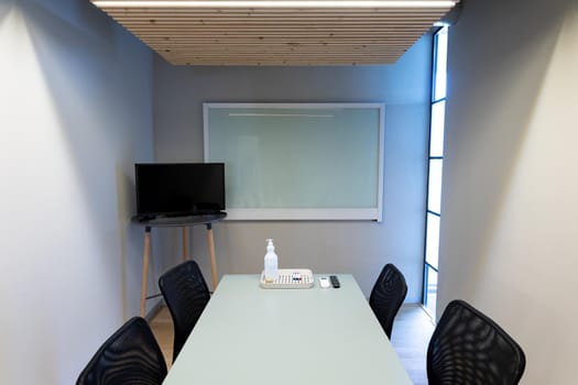 Empty chairs in board room with copy space on screens at office. business, meeting and office workplace.