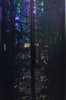 Close up view of wire connections in a modern computer server. cloud computing technology concept.
