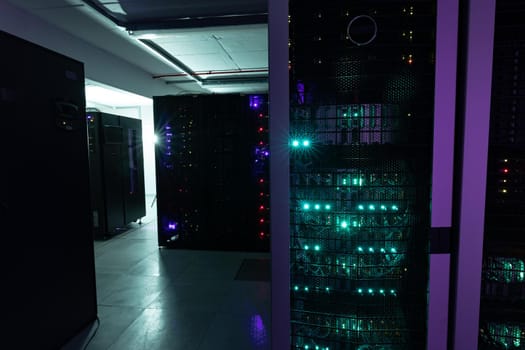 Data center with multiple rows of fully operational server racks. modern cloud computing technology concept.