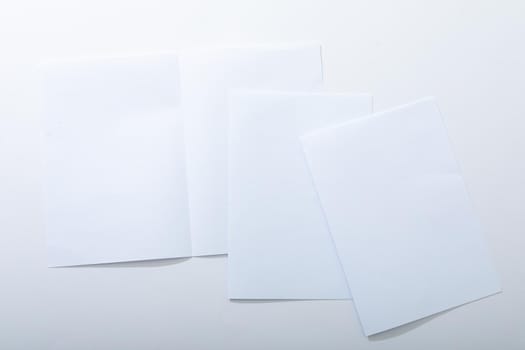 Composition of white cards with copy space on white background. christmas, communication, tradition and celebration concept.