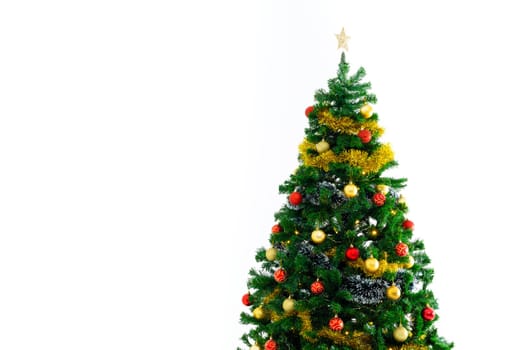 Composition of christmas tree with decorations and copy space on white background. christmas, tradition and celebration concept.