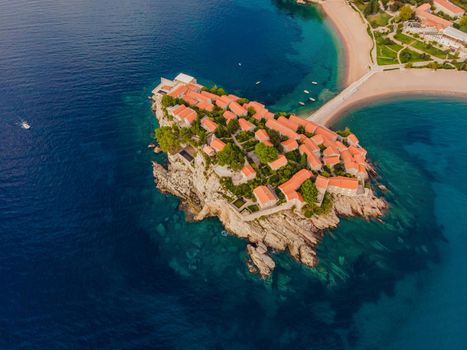 Aerophotography. View from flying drone. Panoramic view of Sveti Stefan island in Budva in a beautiful summer day, Montenegro. Top View. Beautiful destinations.