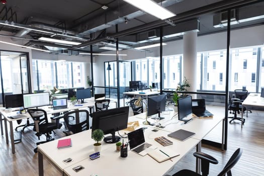 Interior of empty modern office with desks and computers. modern office of a creative design business.