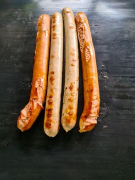 Close up at a grill with sausages on it ready to eat