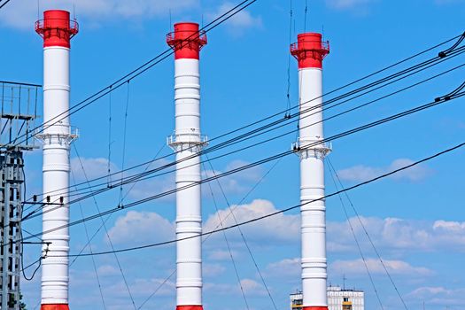 A long line of electrical transmission towers carrying high voltage lines.