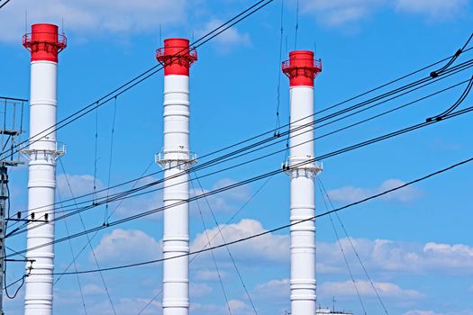 A long line of electrical transmission towers carrying high voltage lines.