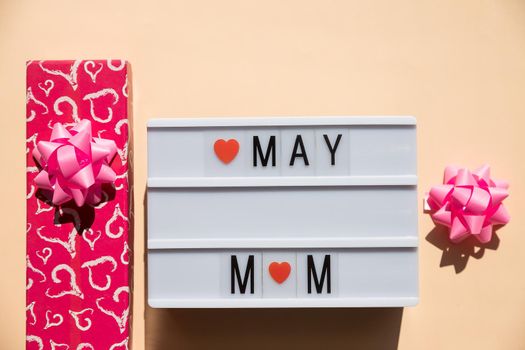 Happy Mother's Day card concept. Wooden calendar, top view, flat lay