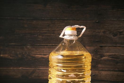 yellow sunflower oil bottle on table .