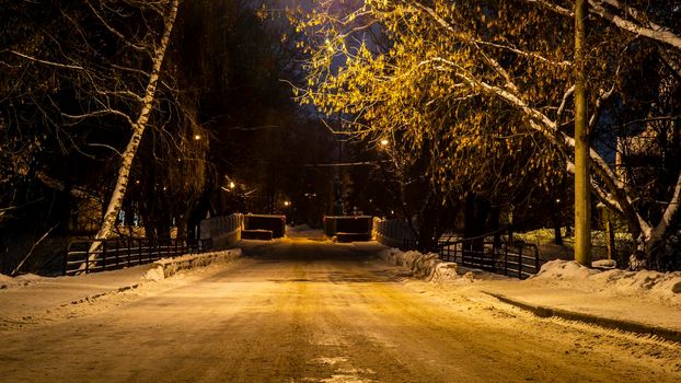 empty street of winter city park. low light