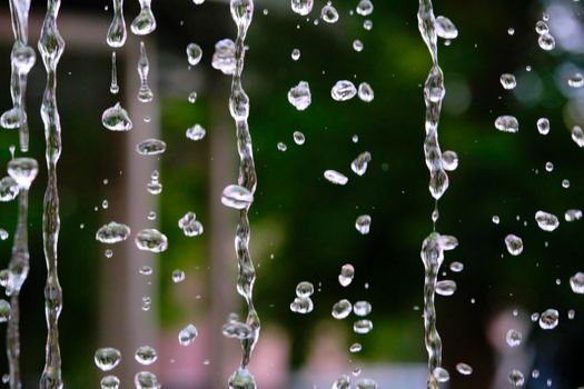 frozen water droplets from the fountain. color. soft focus.