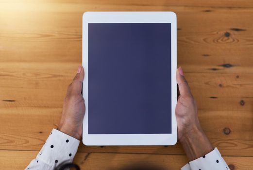 High angle shot of a businesswoman holding a digital tablet.