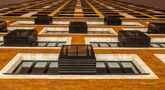 Bottom view of the facade of a new multi-storey residential building with baccos .the new Russian district.