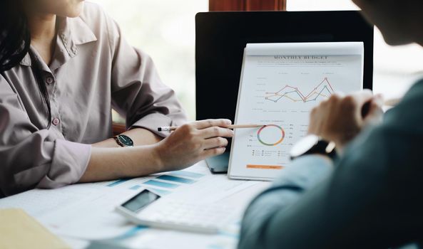 Business people are meeting for analysis data figures to plan business strategies. Business discussing concept