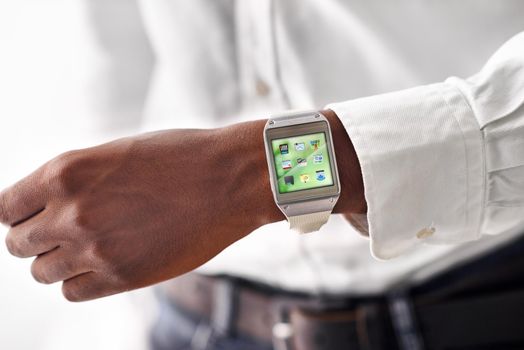 Cropped view of a man wearing a smartwatch - All screen content is designed by us and not copyrighted by others.