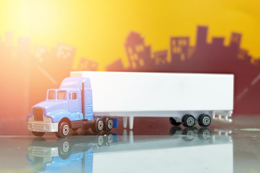 container truck toy on city background