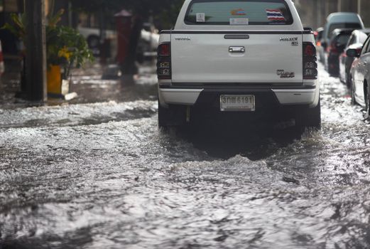 Bangkok ,Thailand ,May 16 ,2019-Flood on public road and mimitruck in traffic view