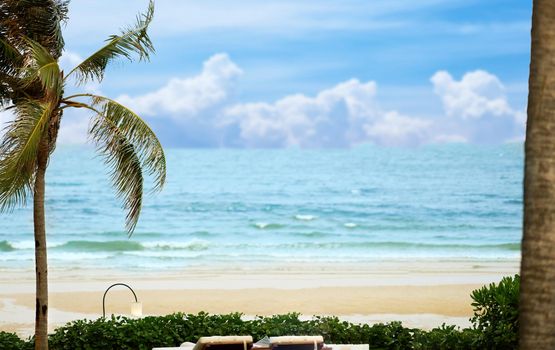 beach front with shade and closed umbrella and sand,no person