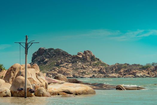 Panoramic view copy space nature landscape background. Calm sea ocean bay sun day summer. Yellow beige gold sand stone rocks beach island. Blue clear sky. Travel play fun paradise concept design.
