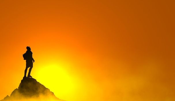 silhouette man on peak for success concept