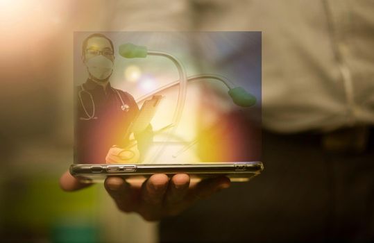 doctor in hologram screen in mobile pnone communication in tele health medicine concept