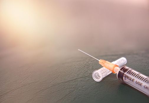 syringe medicine on floor for inject vaccine with needle